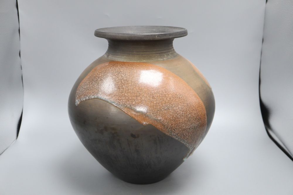 A Raku glazed studio pottery jug by Tim Andrews, height 34cm
